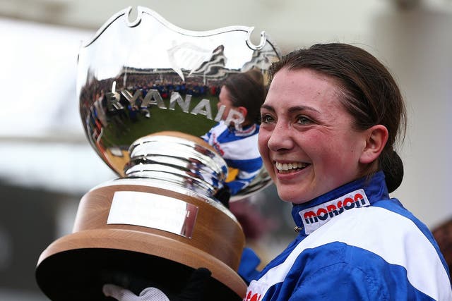 Bryony Frost celebrates with the trophy at Cheltenham