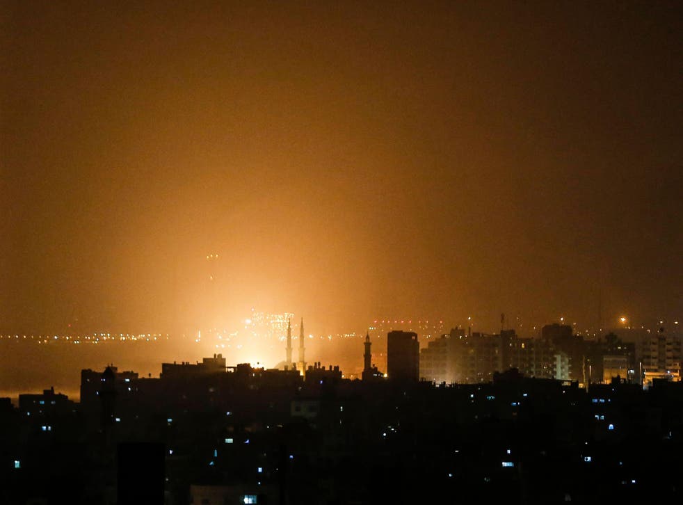 The Gaza sky glows orange during an Israeli airstrike on Friday