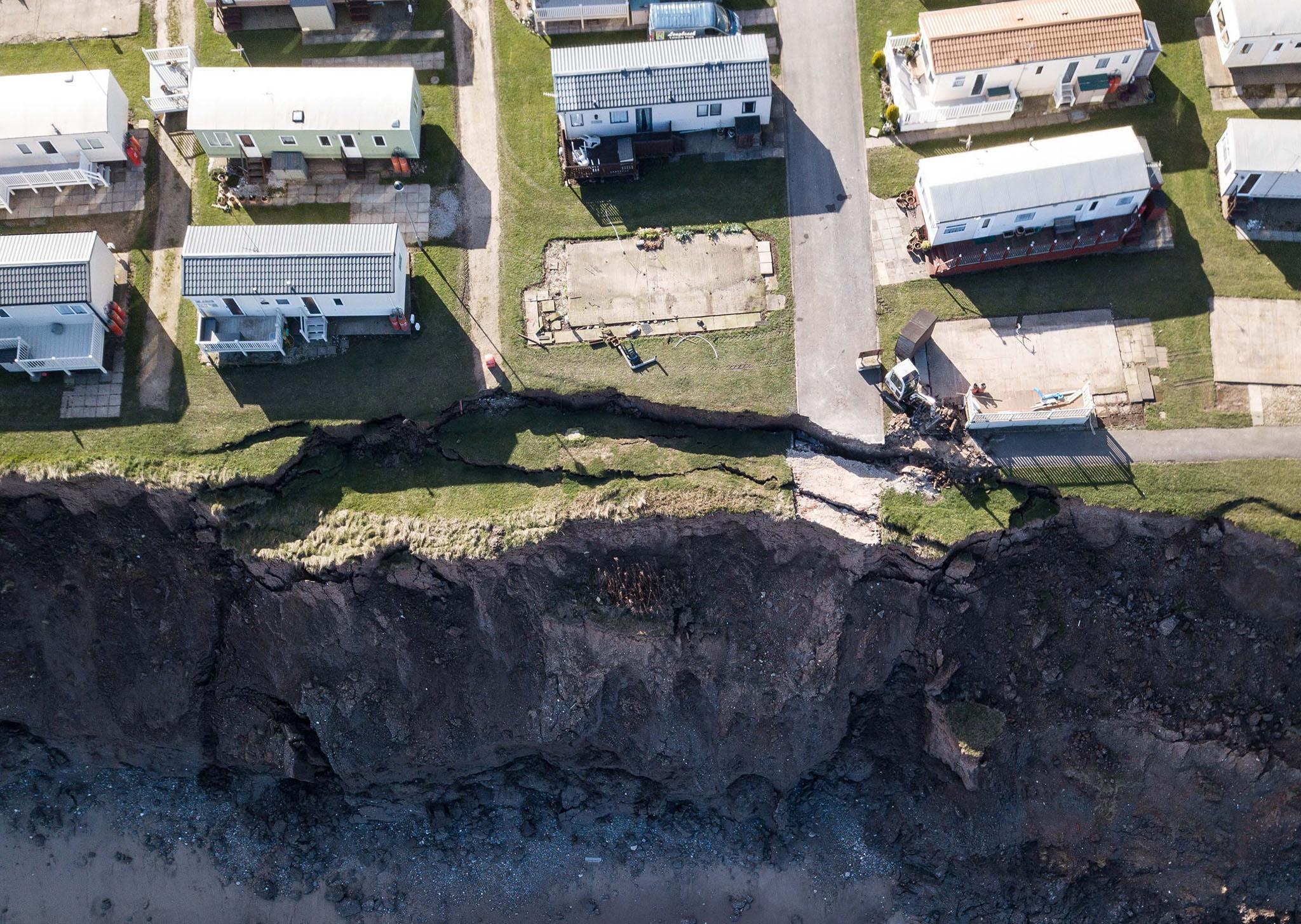 Photographs show a huge crack that has opened in a cliff on the Yorkshire coast just yards away from holiday homes at the Longbeach Leisiure Park in Hornsea