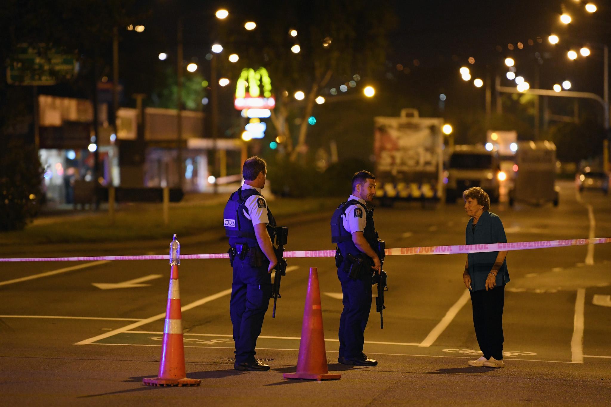 Police speak to a resident as they cordon off Linwood Avenue near the Linwood Masjid on March 15, 2019 in Christchurch, New Zealand