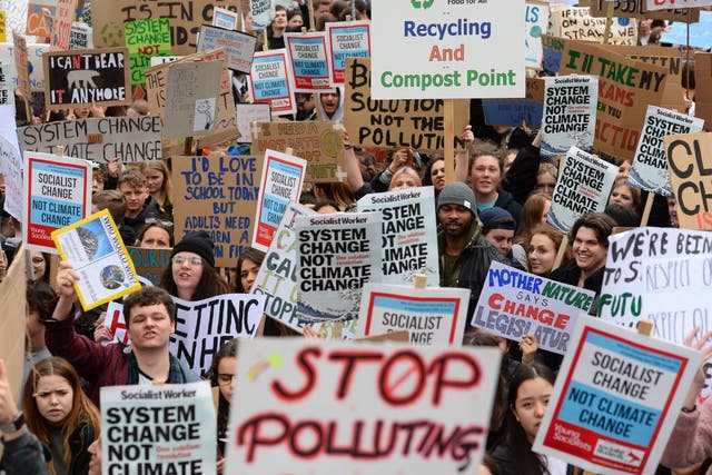 Students take part in a global school strike for climate change in Parliament Square, London