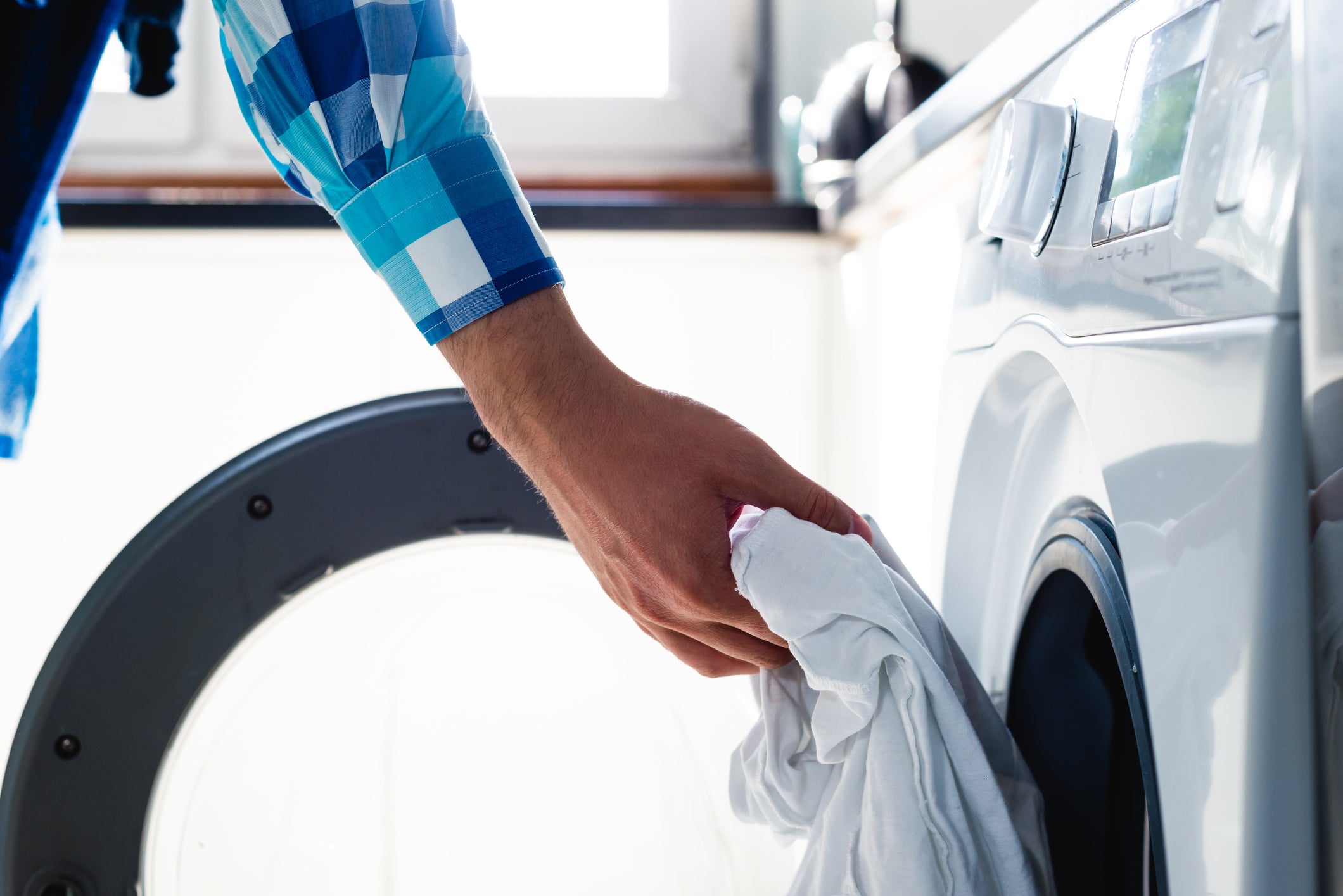 Man does the washing in washing machine