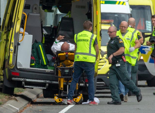 One of the injured is loaded into an ambulance following the Al Noor mosque shooting in Christchurch on Friday