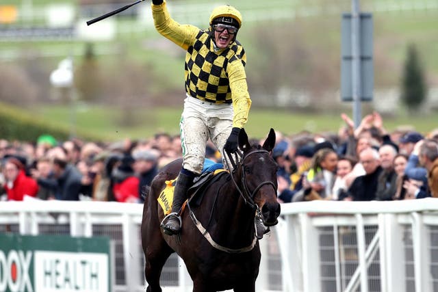 Jockey Paul Townend celebrates his victory in the Gold Cup