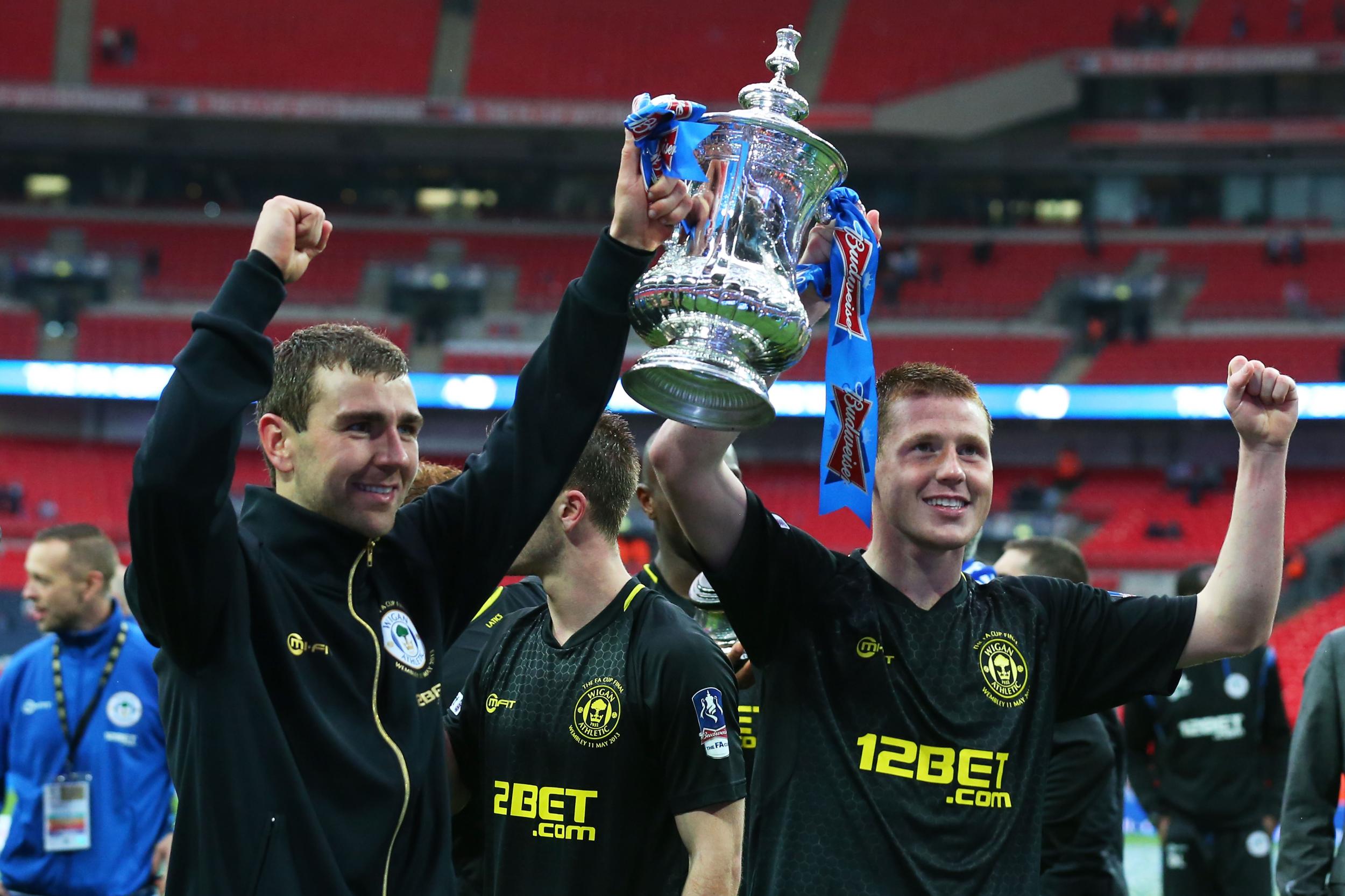 James McArthur celebrates with the FA Cup