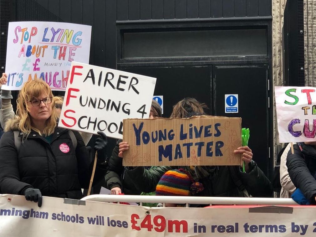 Parents protest outside a conference where education secretary Damian Hinds was speaking on Friday