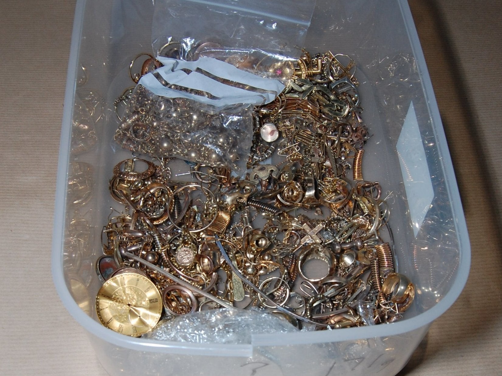 Jewellery in a plastic container found by police at the home of Michael Seed in Islington, north London, which was shown at Woolwich Crown Court.