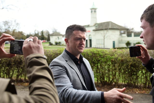 Tommy Robinson, also known as Stephen Yaxley Lennon, talks with the media as he arrives at Peterborough County Court