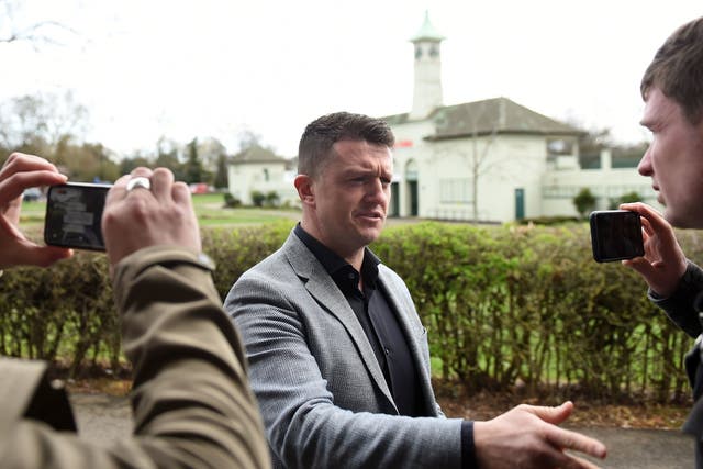 Tommy Robinson, also known as Stephen Yaxley Lennon, talks with the media as he arrives at Peterborough County Court