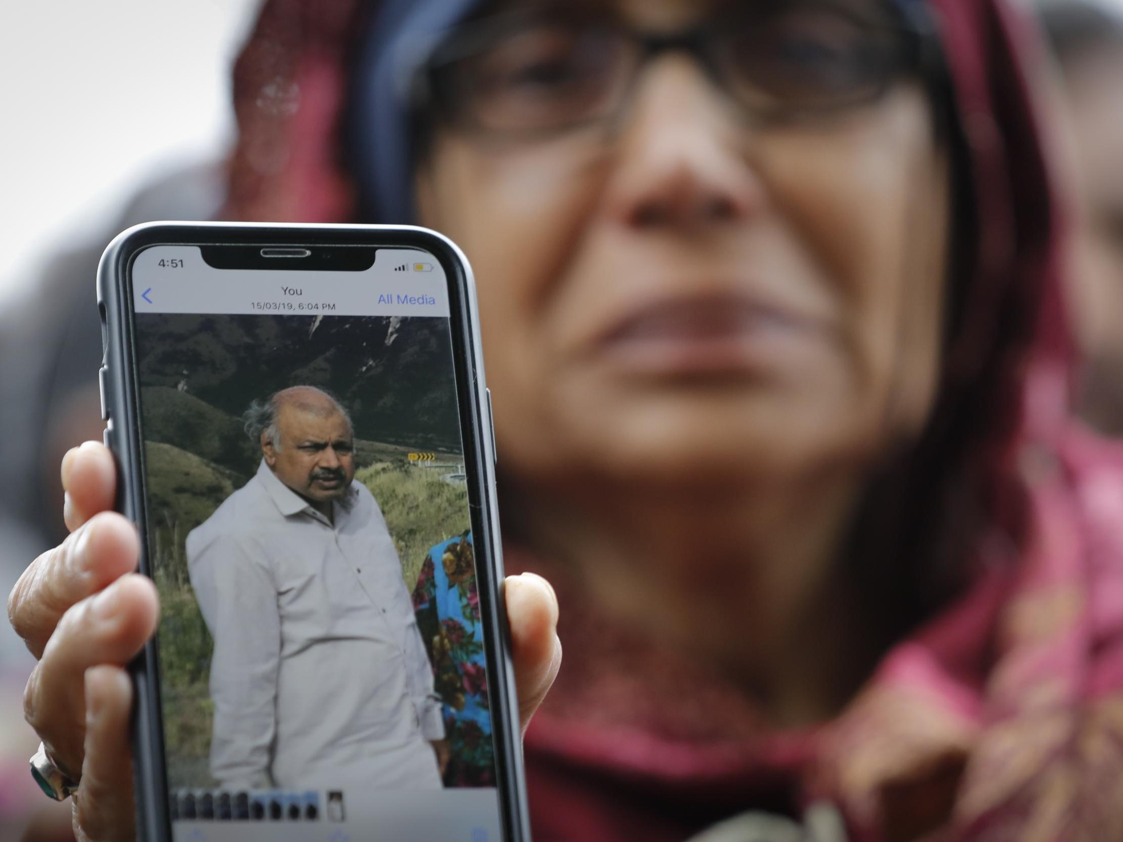 Akhtar Khokhur shows a picture of her missing husband