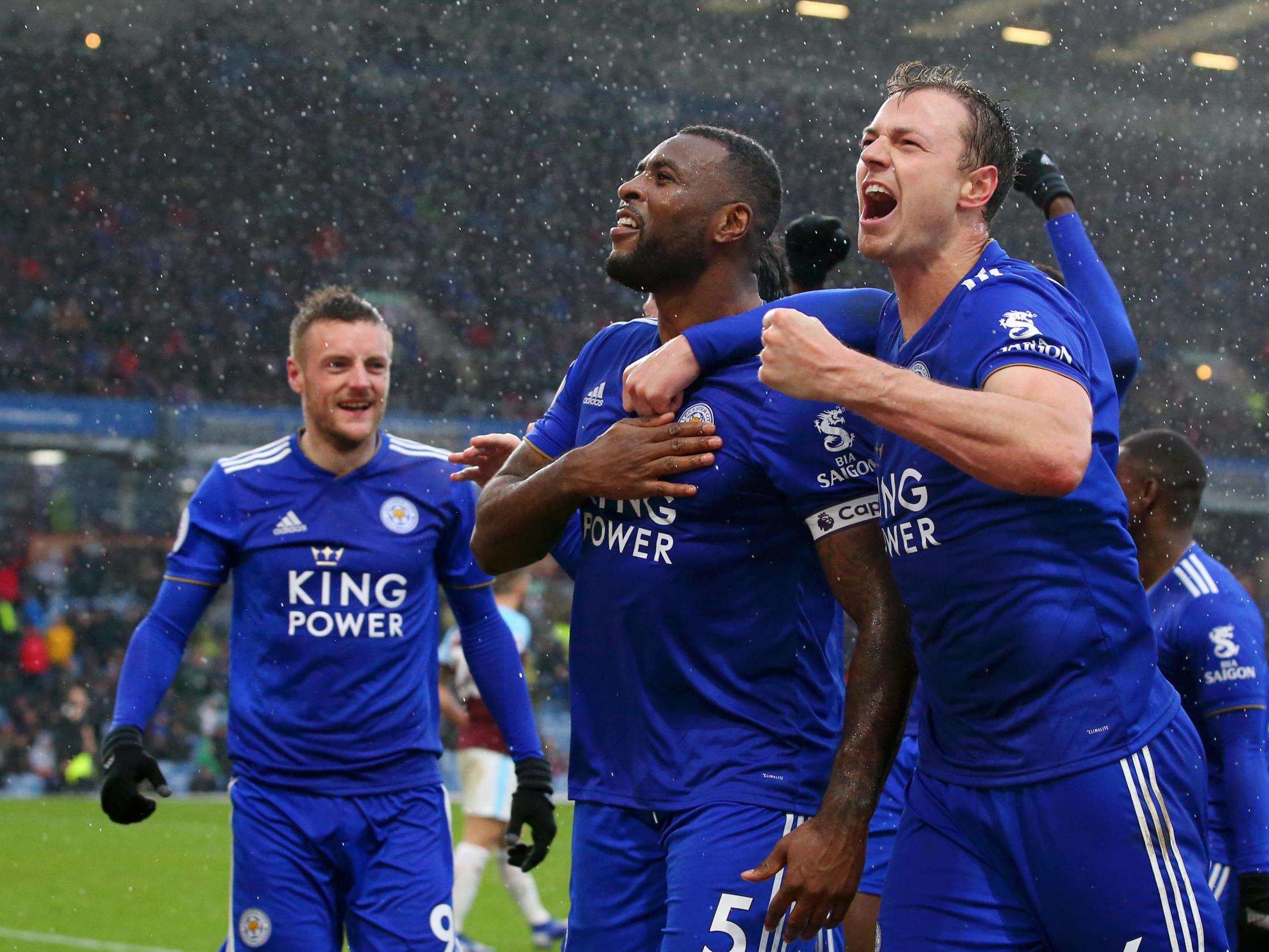 Wes Morgan celebrates with teammates after securing all points for the Foxes