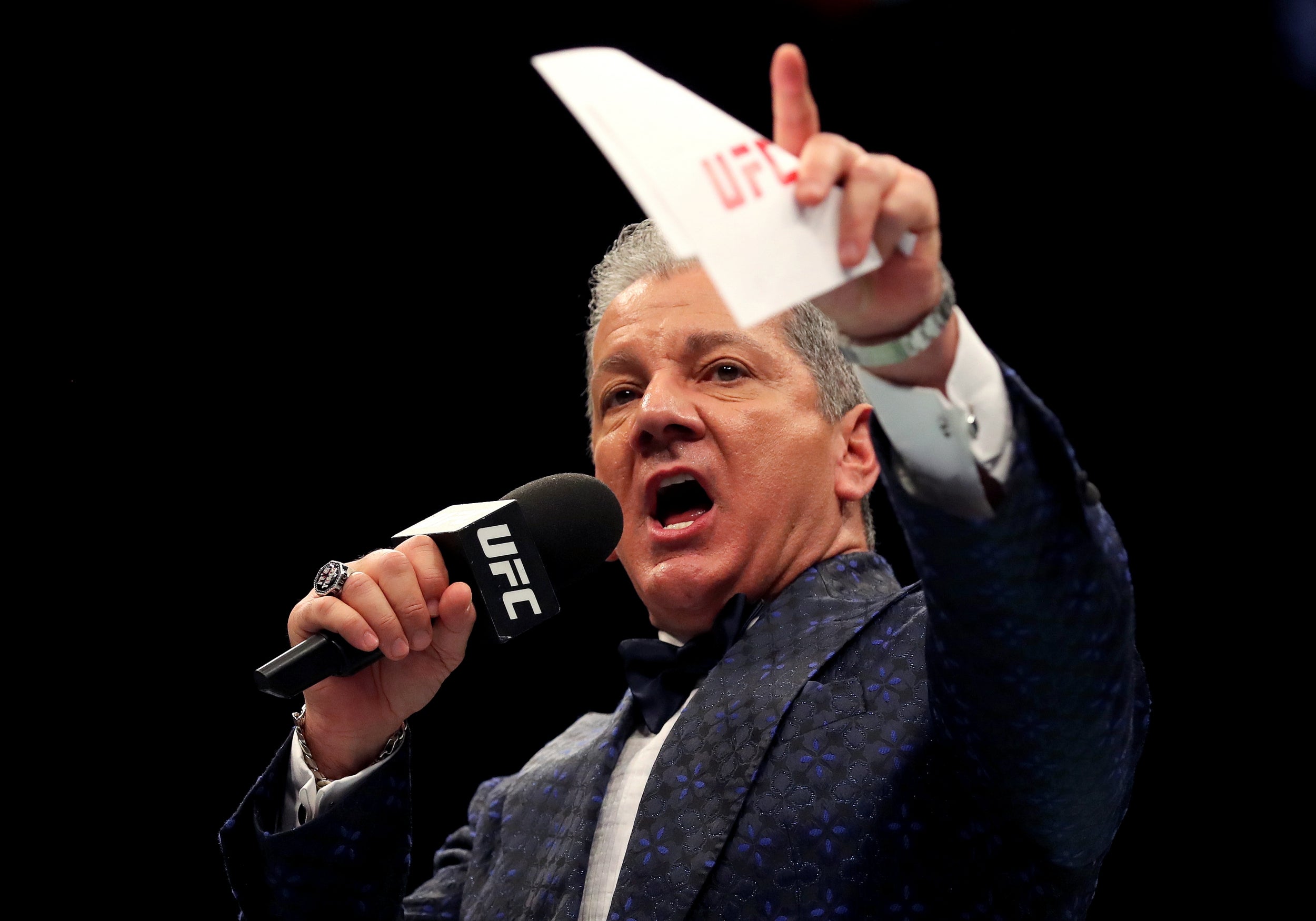 Bruce Buffer speaks to the crowd prior to the Welterweight bout between Dar...