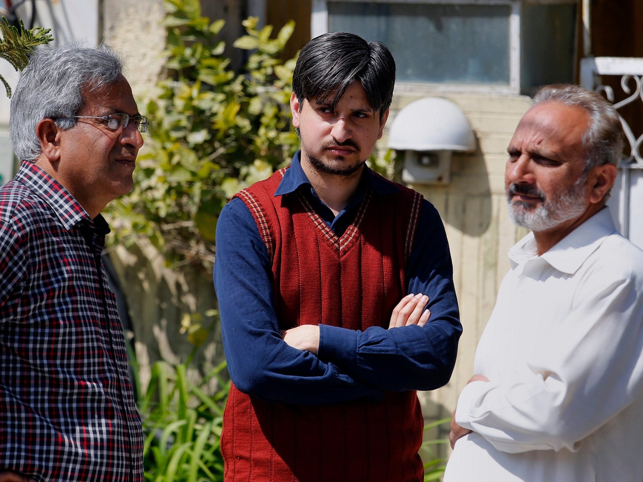 Relatives offer condolence to nephew (centre) of Haroon Mahmood, a Pakistani citizen who was killed in Christchurch mosque shootings.