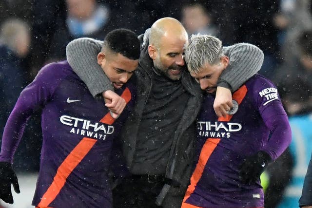 Manchester City's Sergio Aguero and Gabriel Jesus celebrate with manager Pep Guardiola