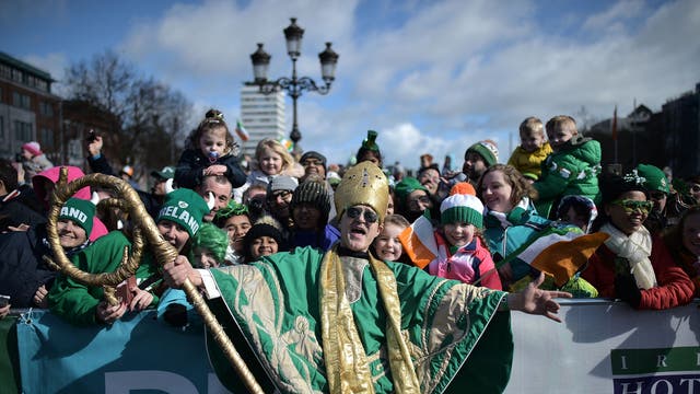 An actor playing the part of Saint Patrick leads the annual Saint Patrick's Day parade in Dublin, Ireland. Saint Patrick, the patron saint of Ireland is celebrated around the world on St. Patrick's Day. According to legend Saint Patrick used the three-leaved shamrock to explain the Holy Trinity to Irish pagans in the 5th-century after becoming a Christian missionary.