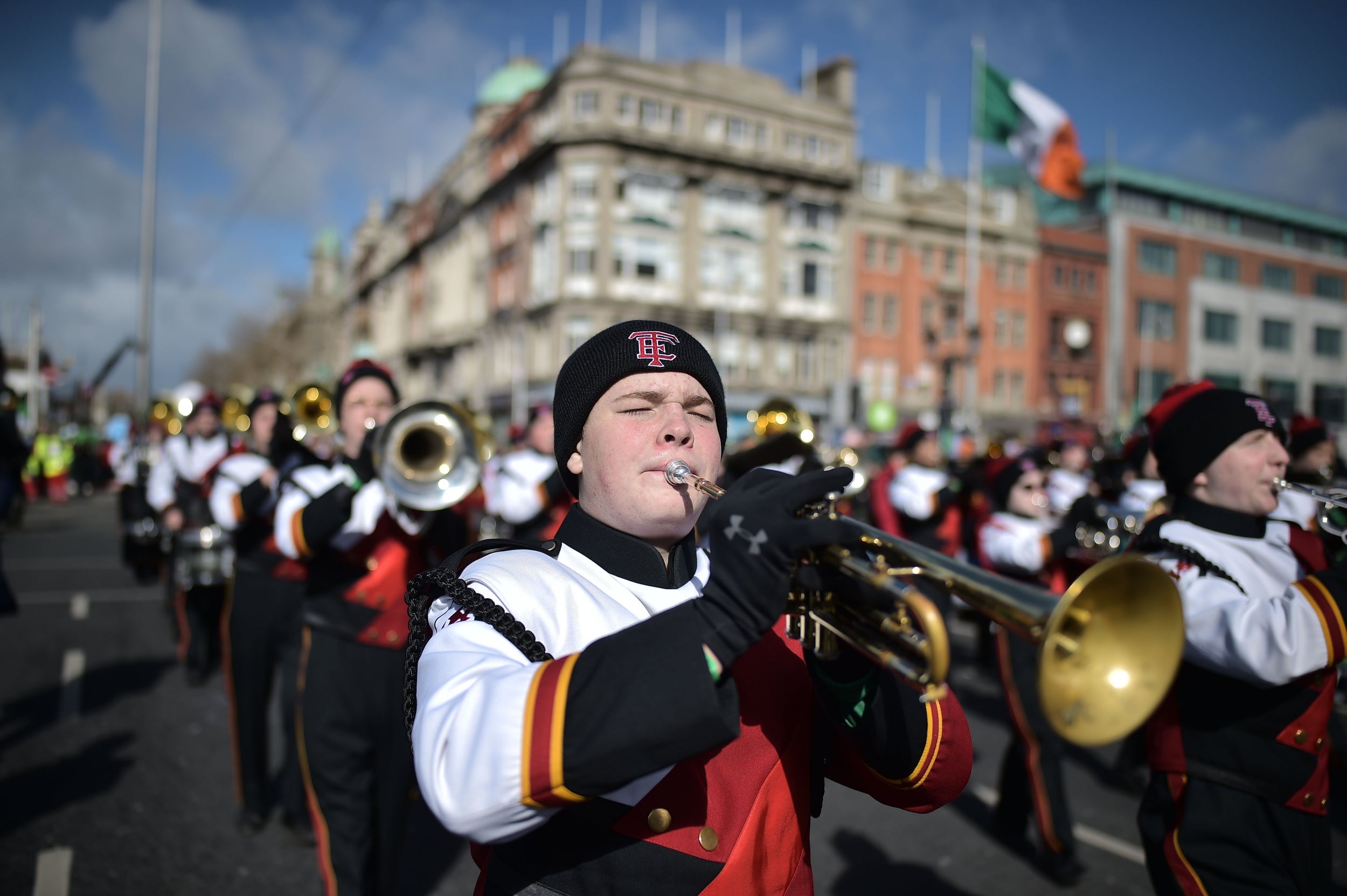 Festival participants take part in the annual Saint Patrick's Day parade on March in Dublin, Ireland. Saint Patrick, the patron saint of Ireland is celebrated around the world on St. Patrick's Day. According to legend Saint Patrick used the three-leaved shamrock to explain the Holy Trinity to Irish pagans in the 5th-century after becoming a Christian missionary