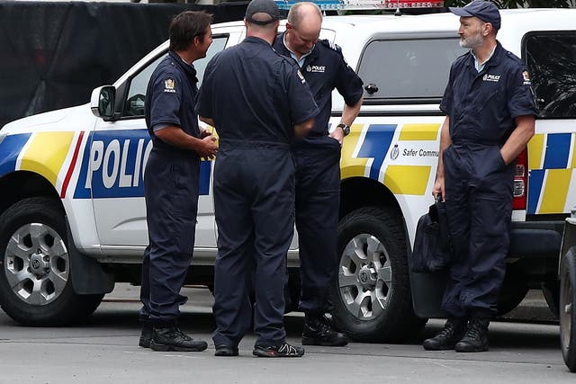 Police at Christchurch Hospital in New Zealand, where staff are still treating 34 people wounded in the attacks