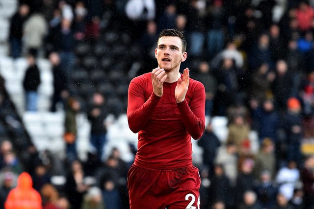 Andy Robertson applauds the Liverpool fans