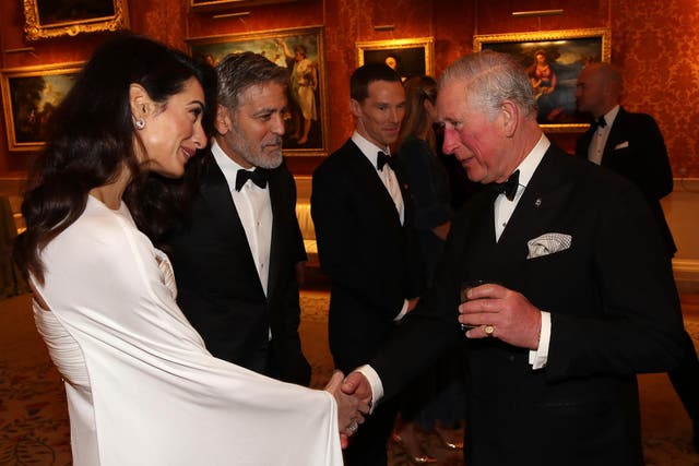 Amal Clooney and George Clooney attend a dinner to celebrate The Prince's Trust, hosted by Prince Charles, Prince of Wales at Buckingham Palace on 12 March 2019 in London, England