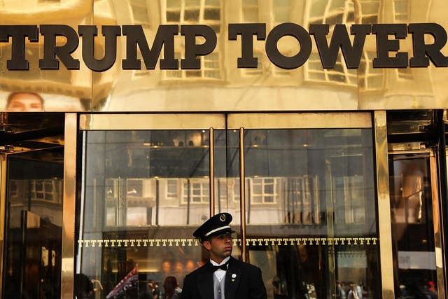 A guard stands outside of Trump Tower on Fifth Avenue in Manhattan on August 24, 2018 in New York City.