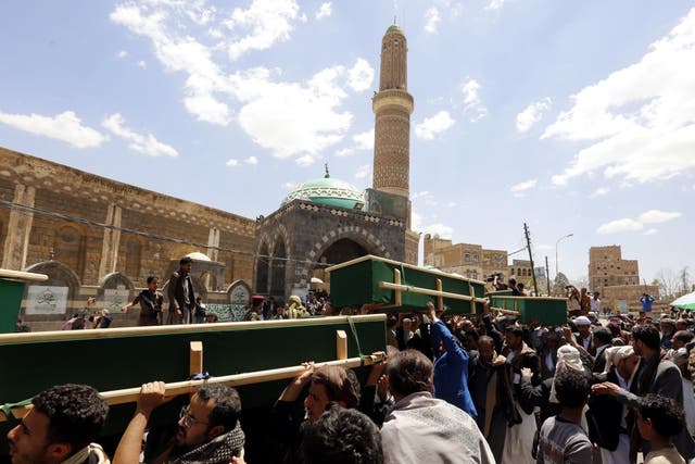 Yemeni mourners carry coffins of people allegedly killed by Saudi-led airstrikes in Sanaa