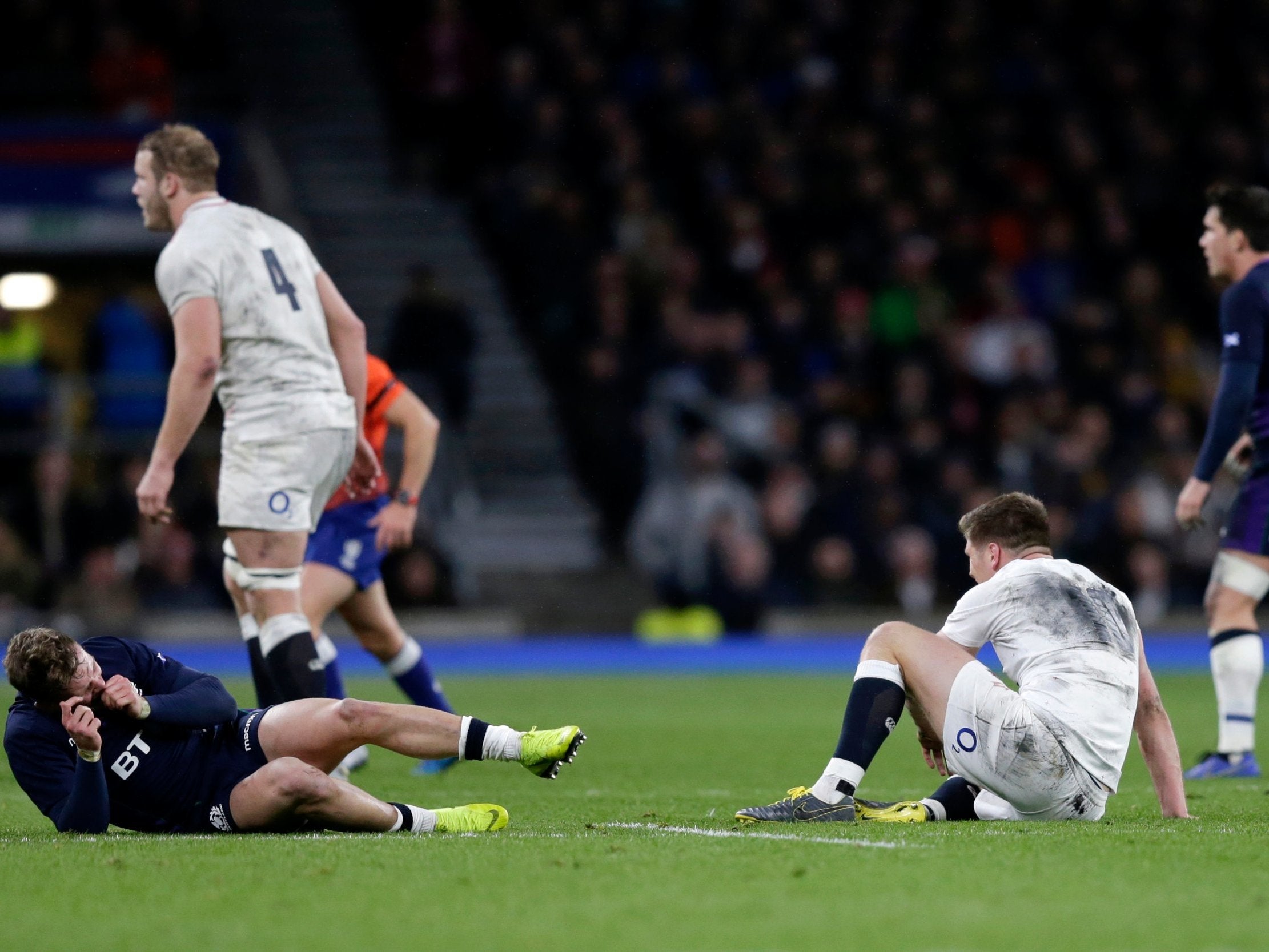 Owen Farrell, right, and Darcy Graham after the England fly-half's tackle