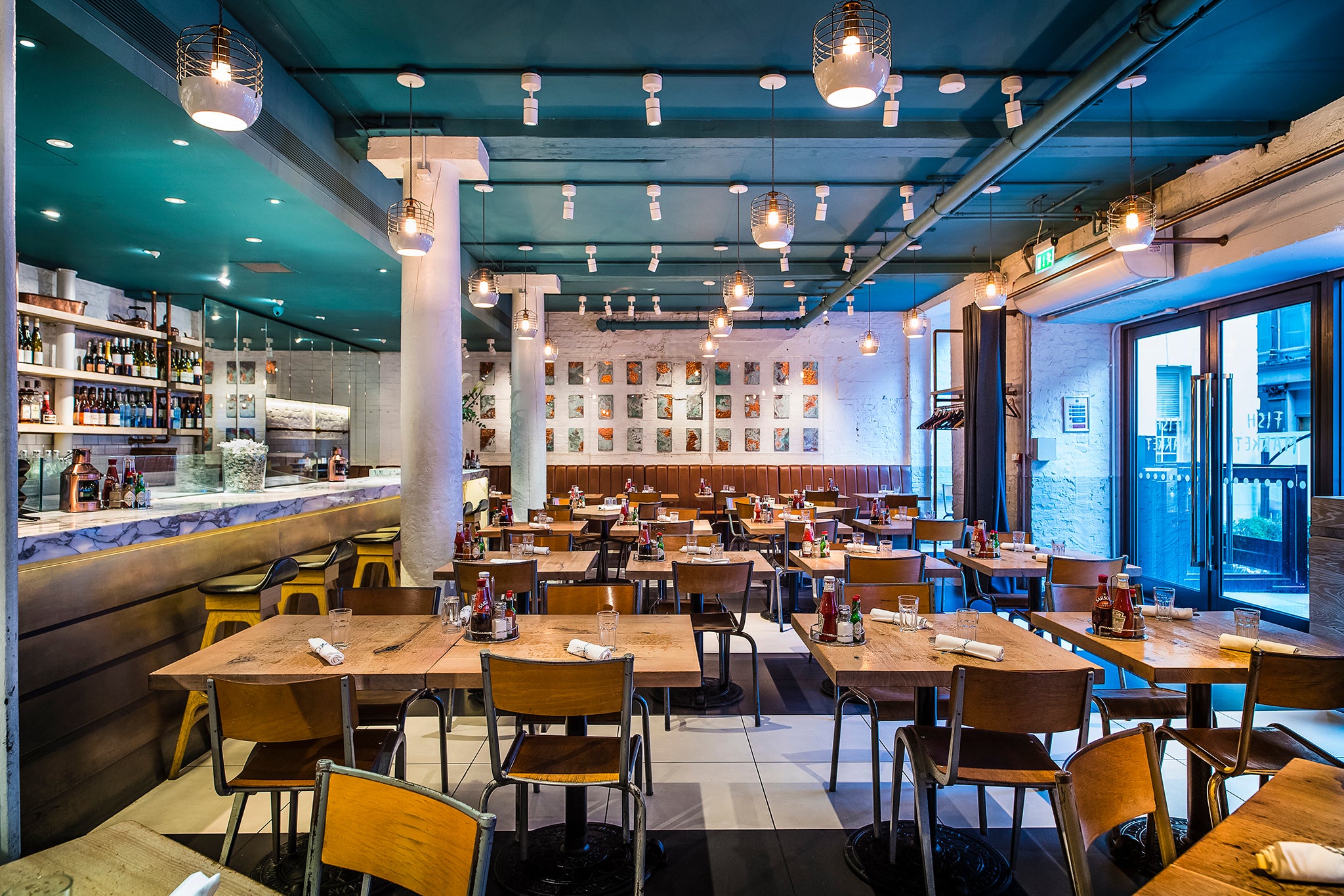 The interior of the New Street restaurant is airy and modern, with heated, canopied seating outside