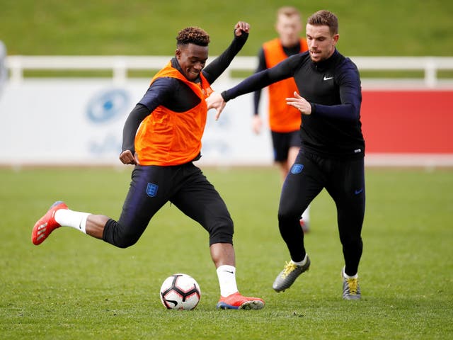 England's Callum Hudson-Odoi with Jordan Henderson during training
