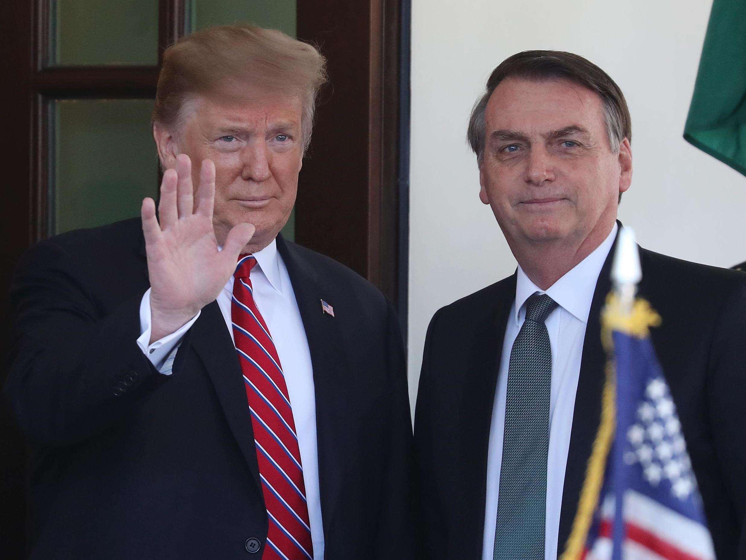 President Donald Trump greets Brazilian President Jair Bolsonaro upon his arrival at the West Wing of the White House March 19, 2019 in Washington, DC.