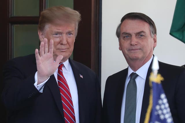 President Donald Trump greets Brazilian President Jair Bolsonaro upon his arrival at the West Wing of the White House March 19, 2019 in Washington, DC.