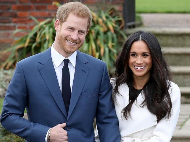 Prince Harry and actress Meghan Markle during an official photocall to announce their engagement at The Sunken Gardens at Kensington Palace on 27 November 2017 in London, England