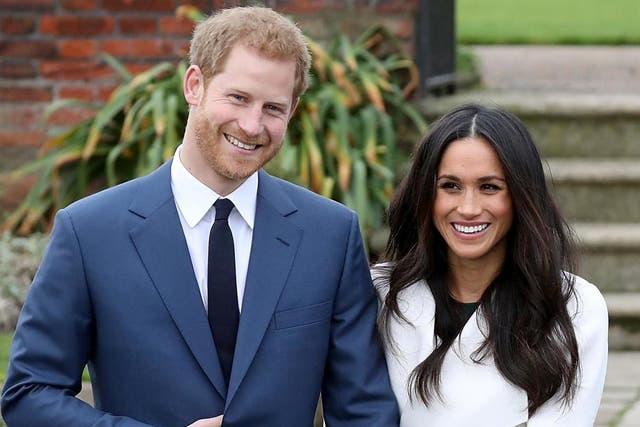 Prince Harry and actress Meghan Markle during an official photocall to announce their engagement at The Sunken Gardens at Kensington Palace on 27 November 2017 in London, England