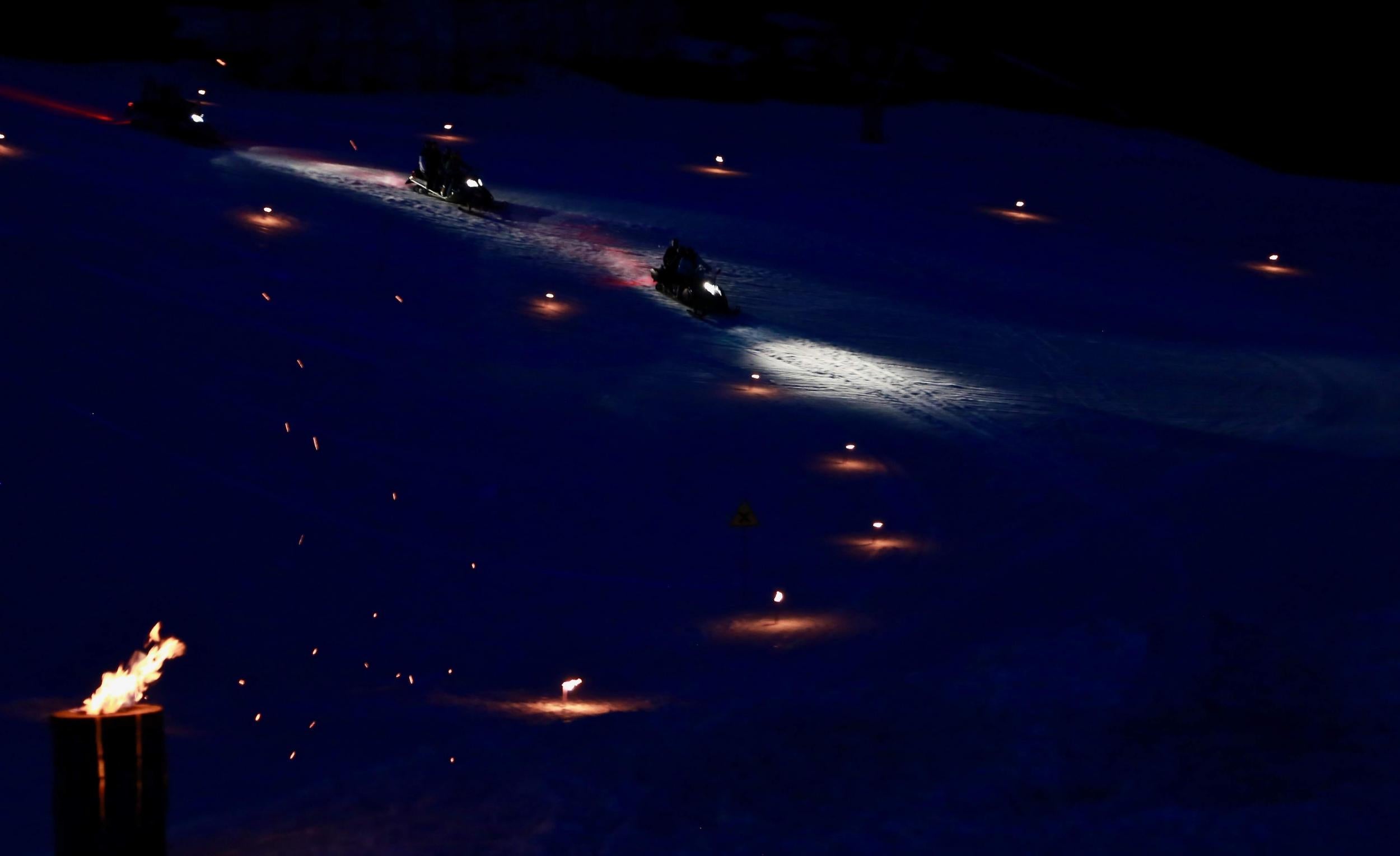 Guests take a nail-biting ride via snowmobile to the mountain restaurant