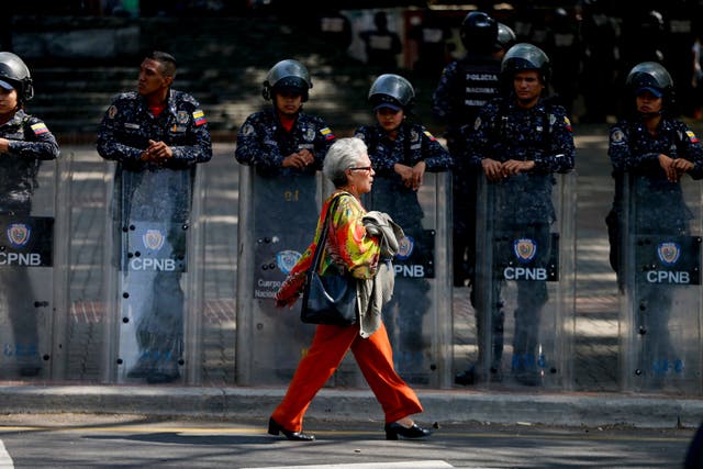 <p>Police stand guard in anticipation of a march called by a coalition of opposition for a law of guarantees that will protect workers who have been victims of political retaliation and unjustified dismissals, in Caracas, Venezuela</p>