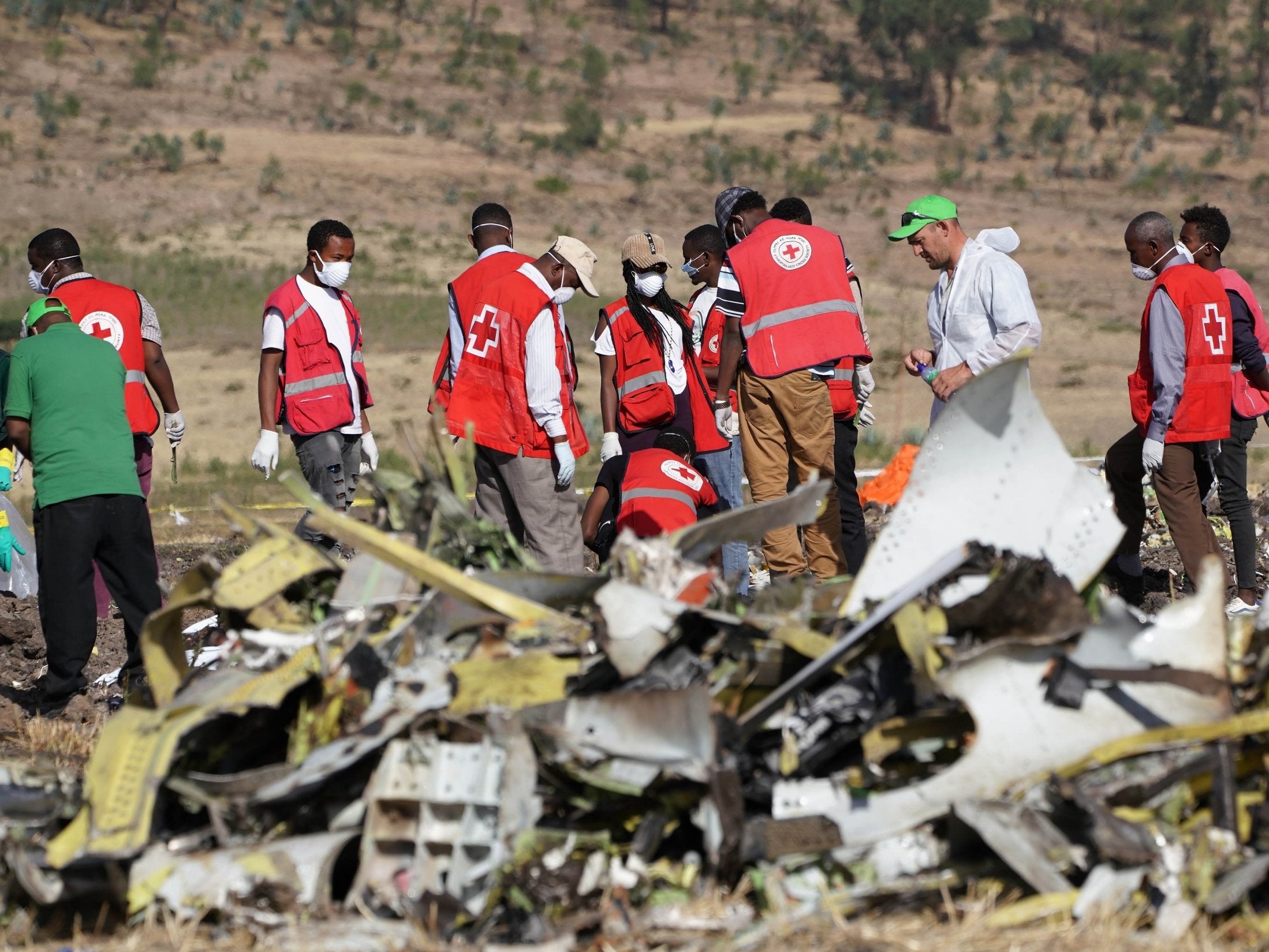 Forensics investigators and recovery teams at the crash site of Ethiopian Airlines Flight ET 302 on 12 March 2019 in Bishoftu, Ethiopia. (Getty Images)