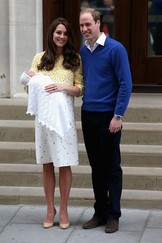 The world gained a new Princess after the Duchess of Cambridge gave birth to her second child, Princess Charlotte Elizabeth Diana, on 2 May 2015 at the Lindo Wing, weighing 8lbs 3oz.
The baby royal made her public debut just 10 hours after her birth in the same shawl that was worn by Prince George.
The newborn also wore a knitted a cap designed by Spanish brand Irulea.
For her second appearance at the Lindo Wing after giving birth, Kate chose a pastel yellow and white floral print dress by British designer Jenny Packham, who also created her first post-pregnancy dress for her appearance following Prince George’s birth two years prior.