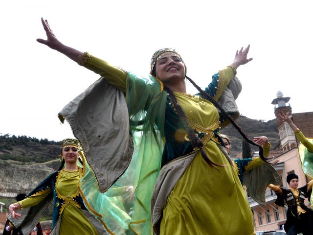 Members of the Azeri diaspora in Georgia wearing traditional costumes dance as they celebrate Nowruz in Tbilisi on 21 March 2017