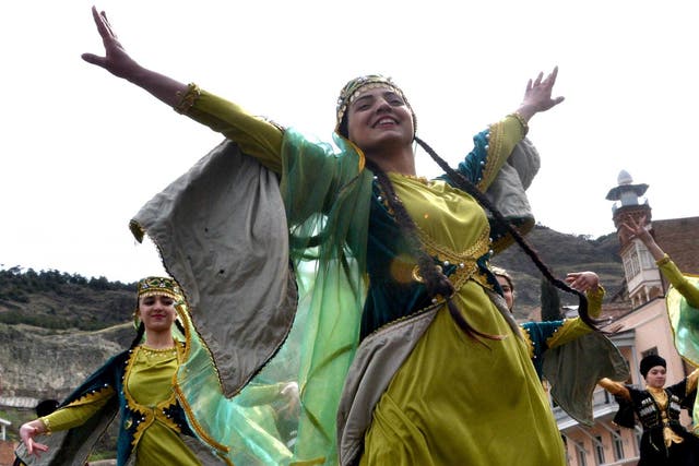 Members of the Azeri diaspora in Georgia wearing traditional costumes dance as they celebrate Nowruz in Tbilisi on 21 March 2017