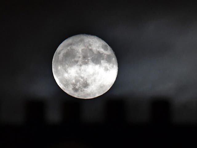 A supermoon, which occurs when a full moon passes closest to the Earth, can appear even bigger when it is close to the horizon thanks to an optical illusion