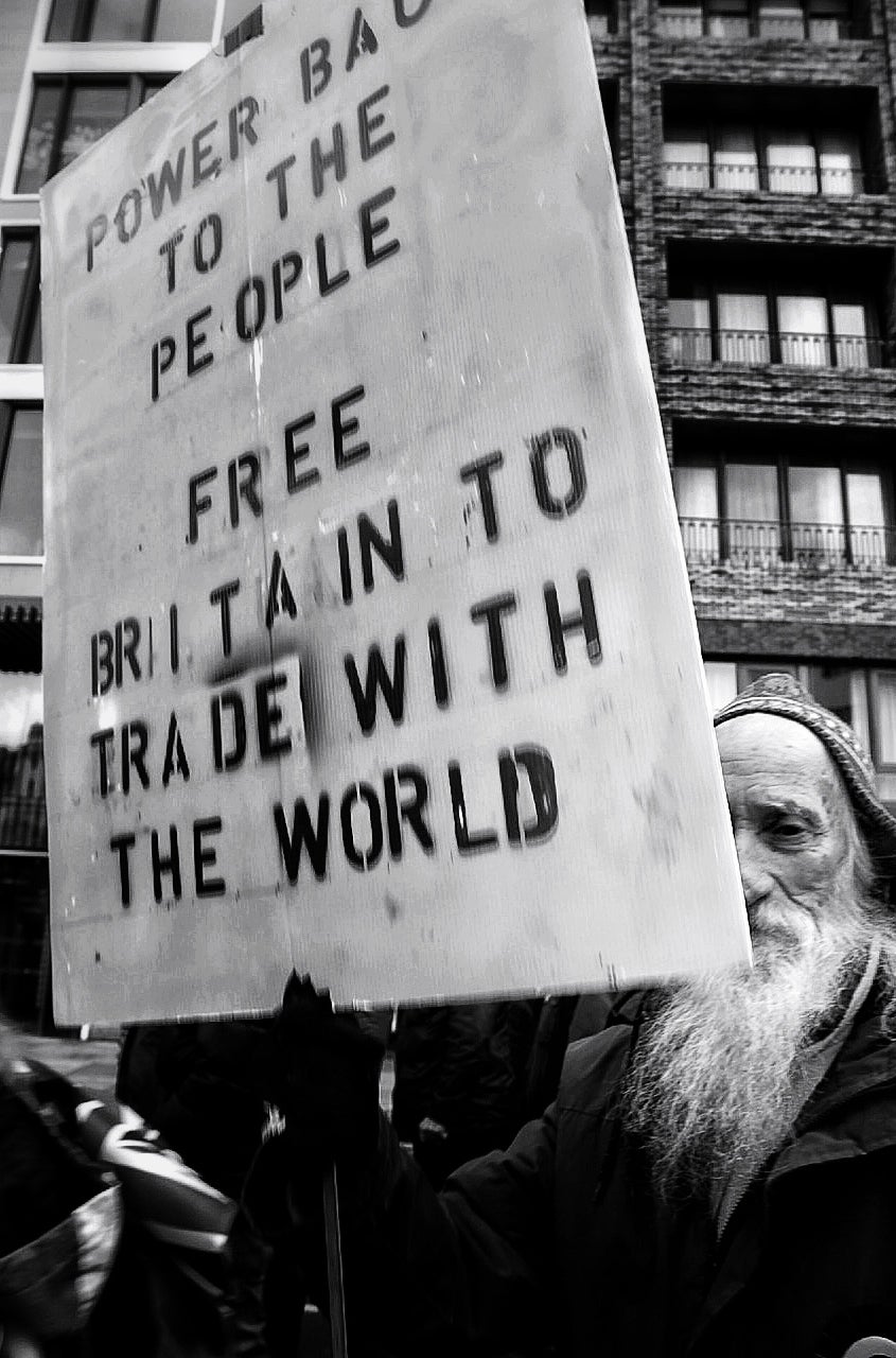 A protester holds a pro-Brexit sign on the march