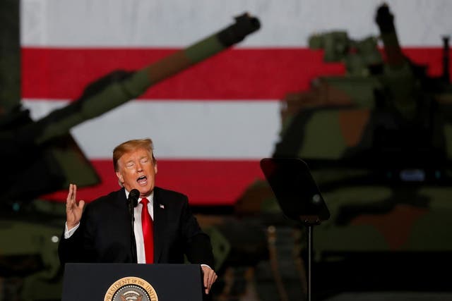 US president Donald Trump speaks to workers in front of US Army tanks on display at the Lima Army Tank Plant (LATP) Joint Systems Manufacturing Center, the country's only remaining tank manufacturing plant, in Lima, Ohio