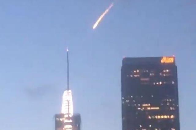 The 'meteor' appeared to pass in front of the tower on the Wilshire Grand Center skyscraper in downtown LA