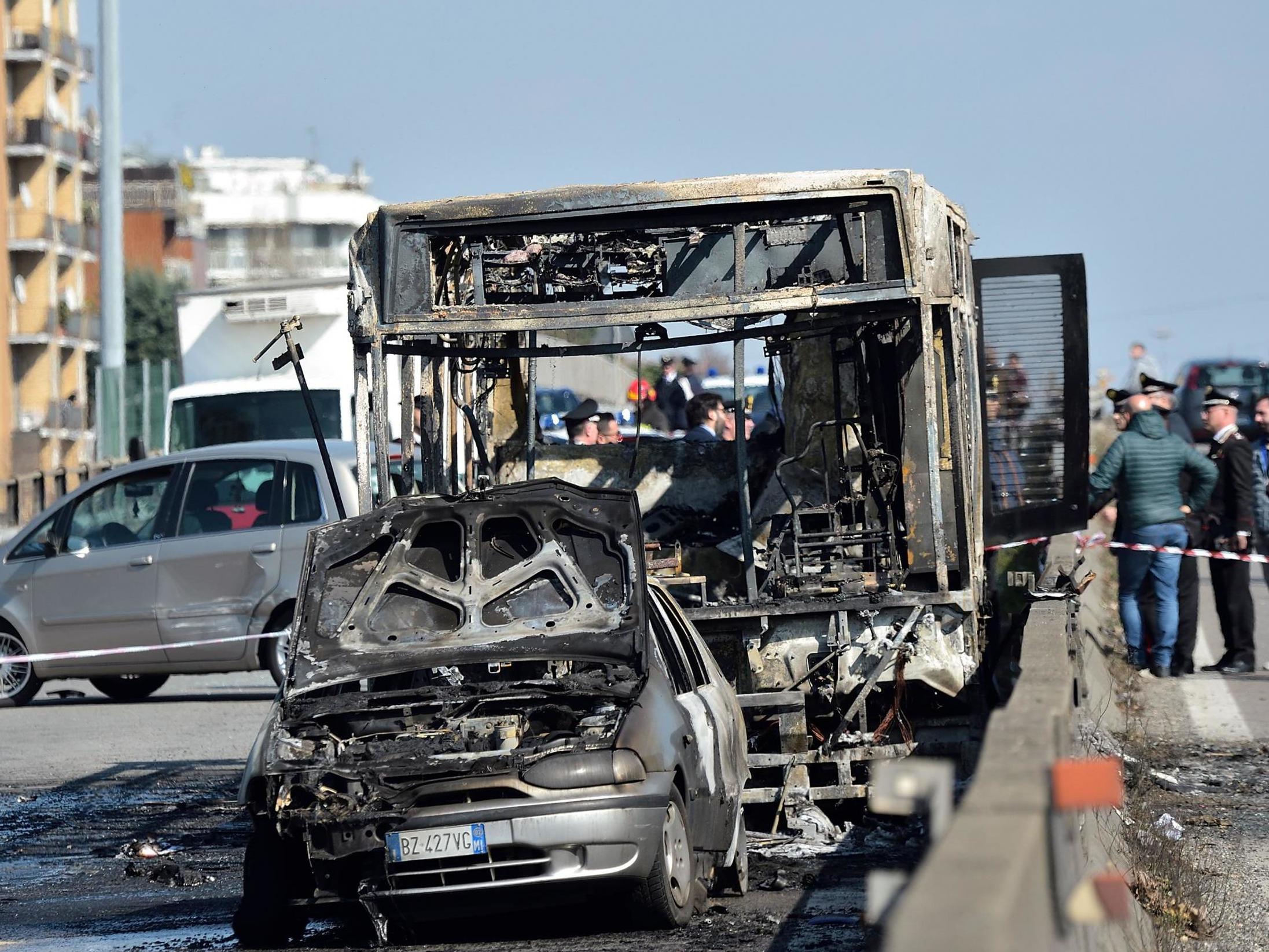 The wreckage of a school bus that was transporting some 50 children after it was torched by the bus' driver, in San Donato Milanese, southeast of Milan
