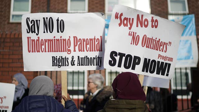 Parents and protesters outside of the Parkfield Community School in Birmingham where the 'No Outsiders' programme teaches children about LGBT rights