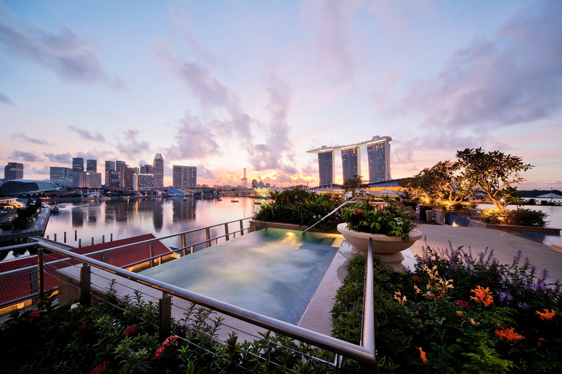 Watch the sun set from the rooftop jacuzzi at the Fullerton Bay Hotel