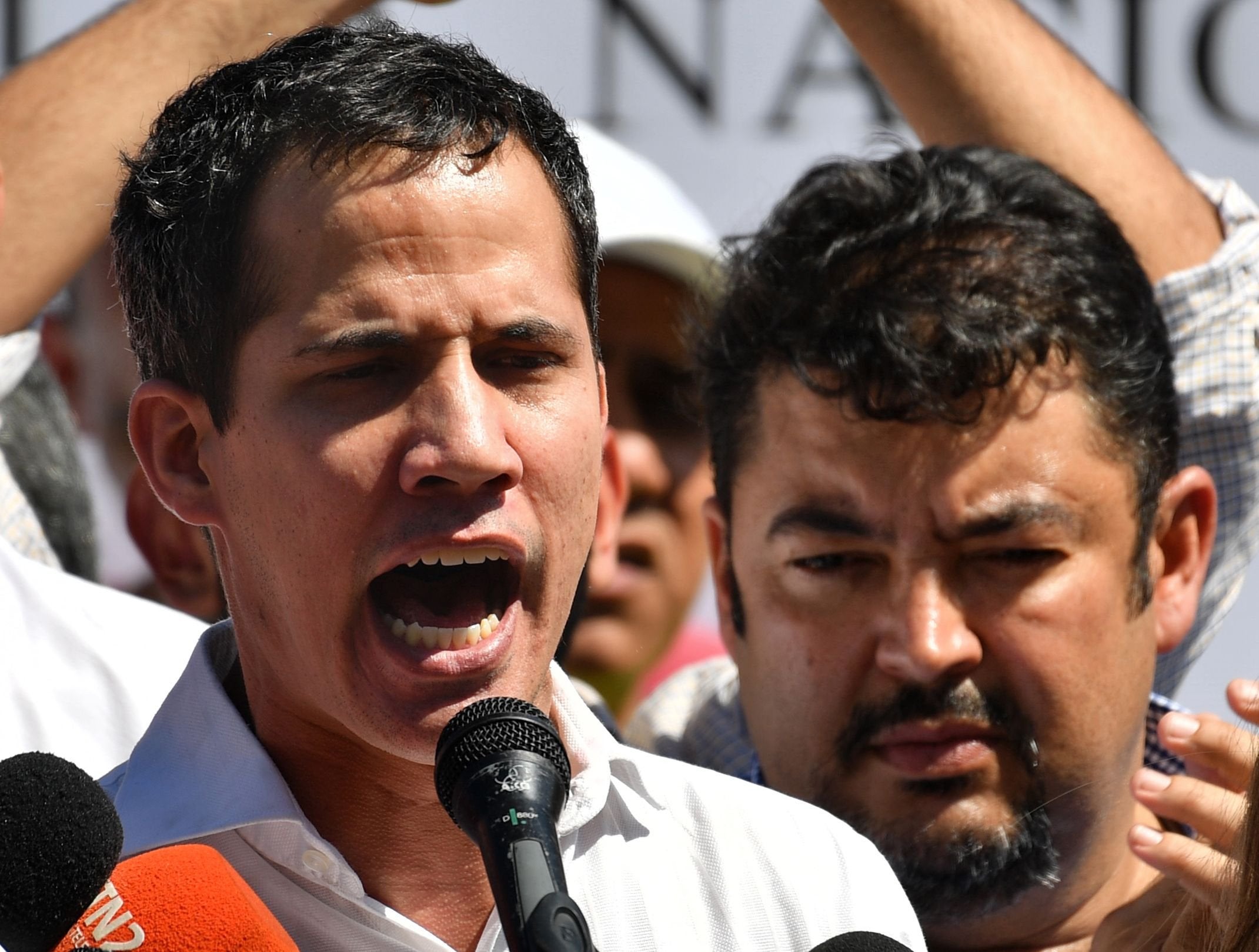 Juan Guaido (left) has said intelligence agents arrested his chief on staff Roberto Marrero (right) following a pre-dawn raid