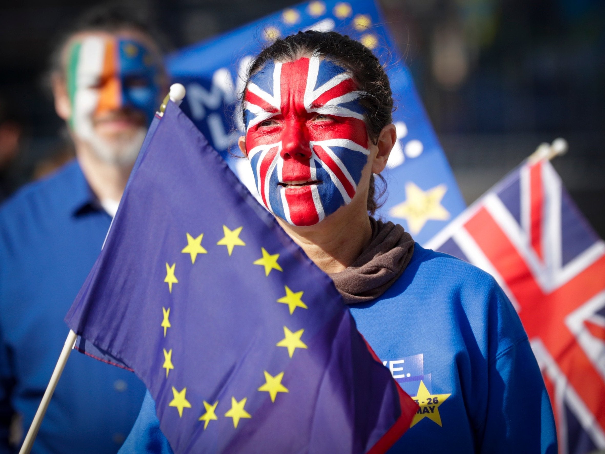 A protester with face painted with the colors of British flag during a protest staged by about 20 anti-Brexit demonstrators calling for a second referendum on Brexit in front of EU Commission Building ahead of EU Summit in Brussels