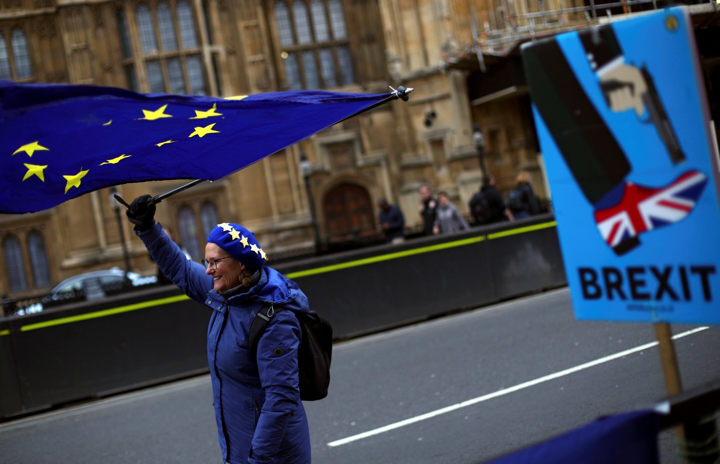 A protester waves an EU flag outside Parliament on Wednesday