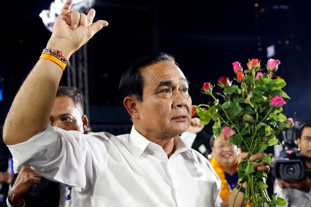 Thailand's prime minister and 2014 coup leader Prayuth Chan-ocha attends the Palang Pracharat party's final major rally in central Bangkok