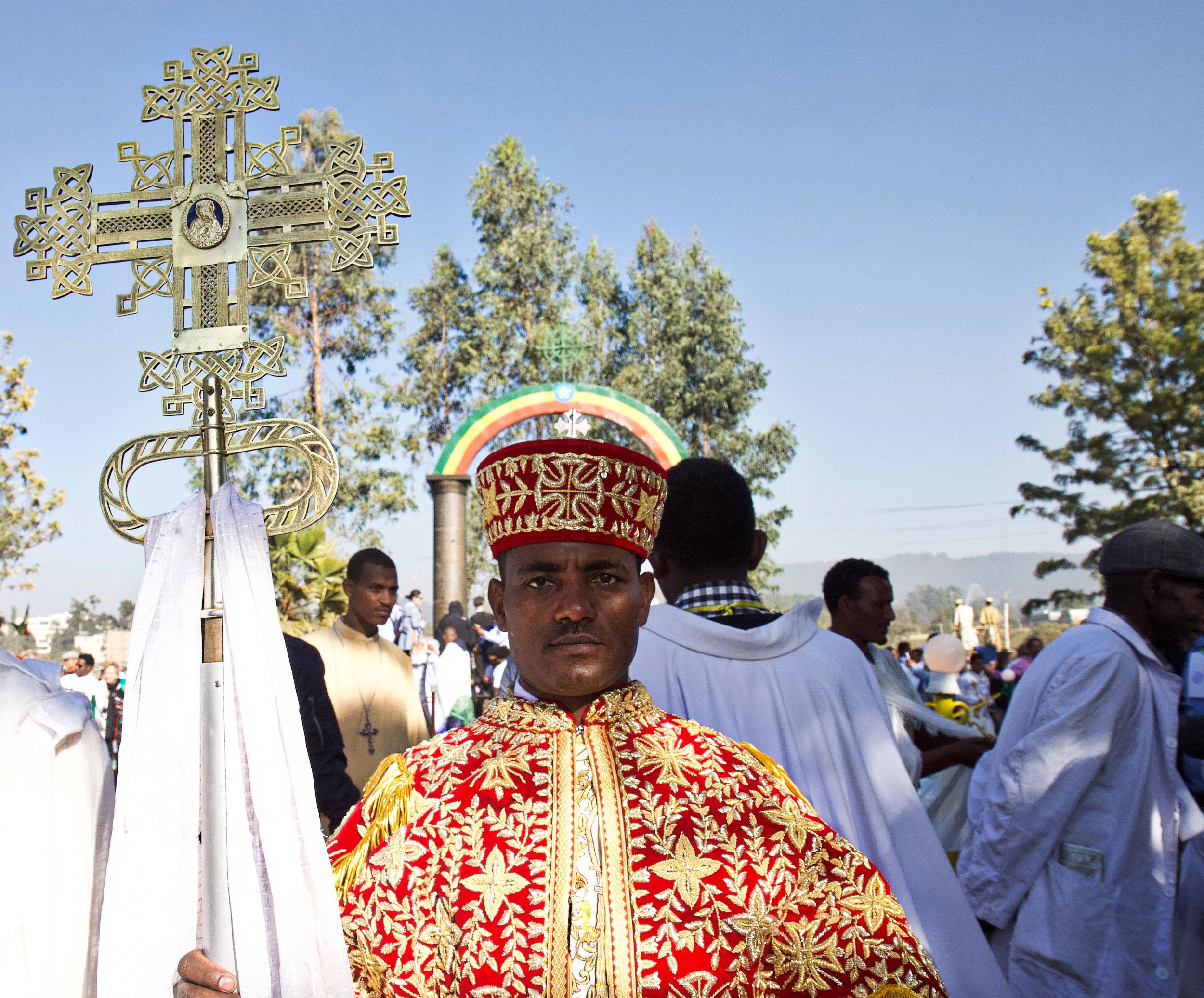 A Timket celebrant with an elaborate cross
